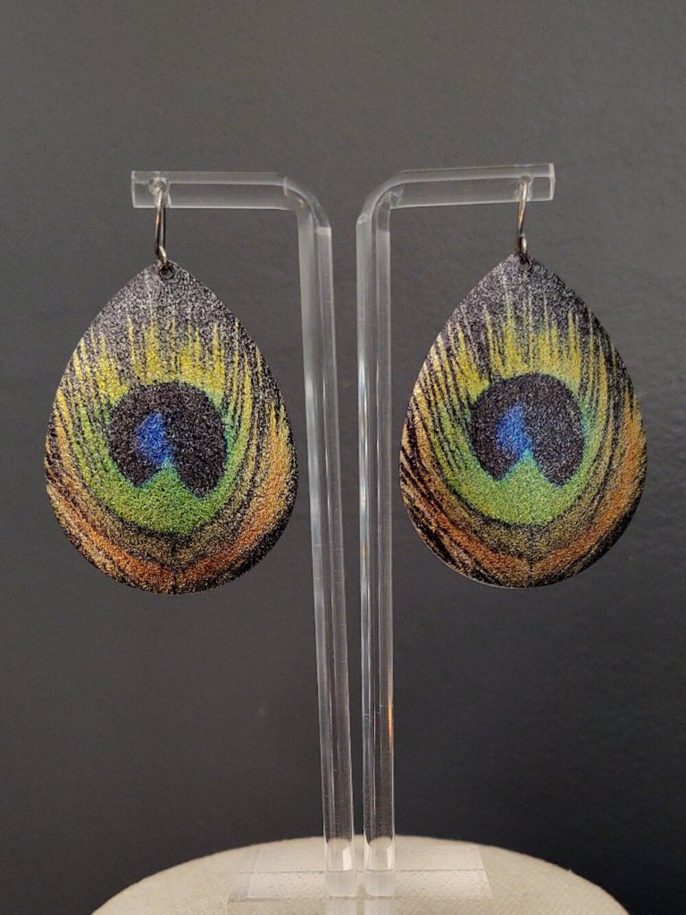 Peacock feather motif metal earrings